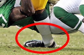close up of a football player getting a high ankle injury