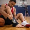 Basketball athlete wearing Ultra CHILL ankle icing sleeve for post play recovery